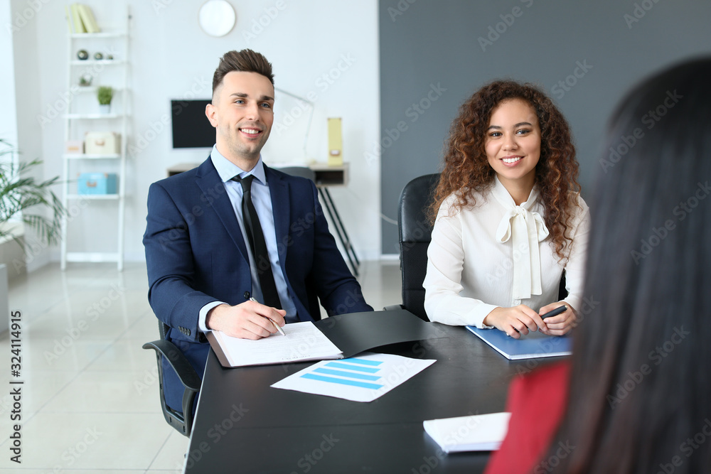 Human resources commission interviewing woman in office