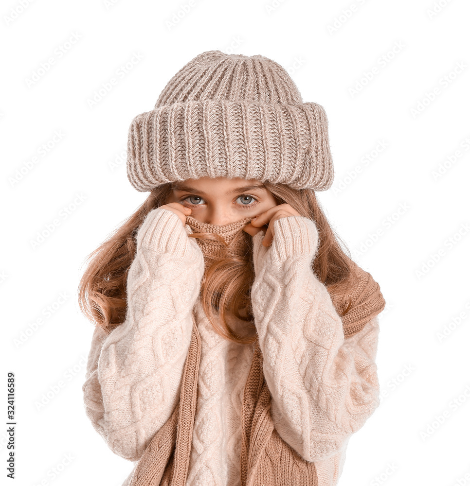 Cute little girl in winter clothes on white background