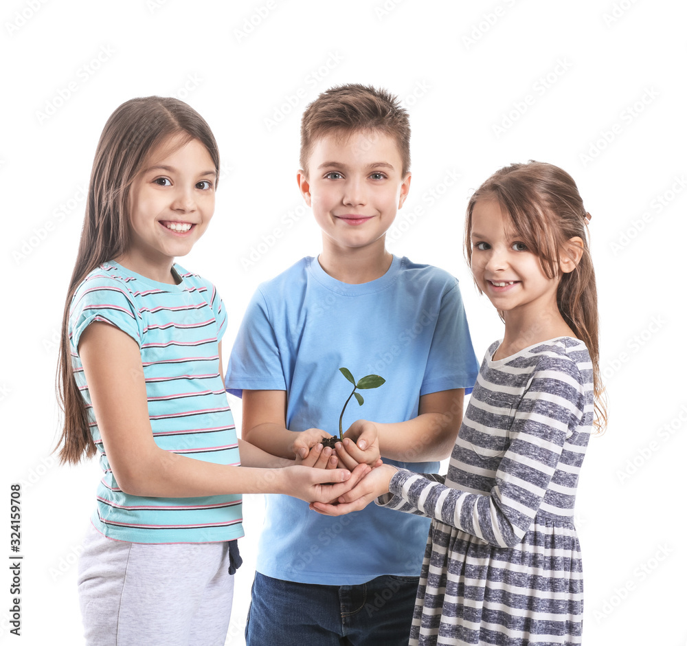 Little children with plant and soil on white background. Earth Day celebration