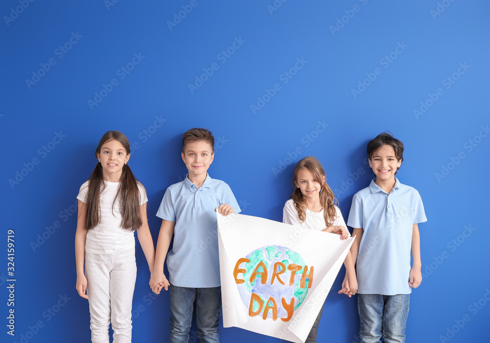 Little children with drawing on color background. Earth Day celebration