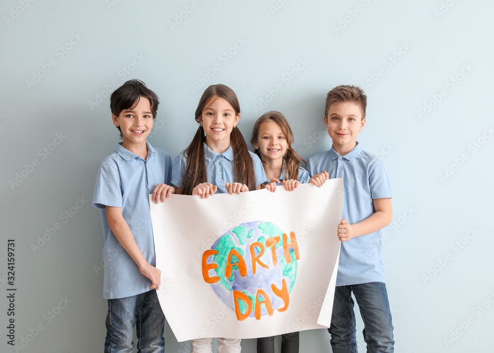 Little children with drawing on color background. Earth Day celebration