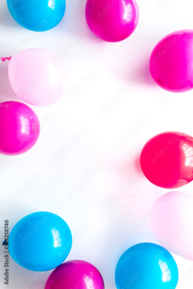 Colorful balloons frame on white background top-down frame copy space