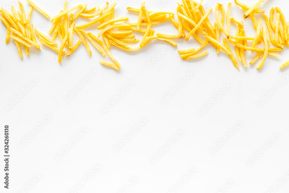 French fries frame on white table top-down copy space