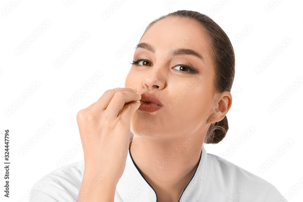 Beautiful female chef on white background