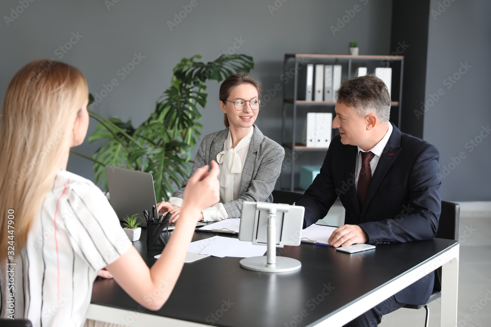 Human resources commission interviewing woman in office