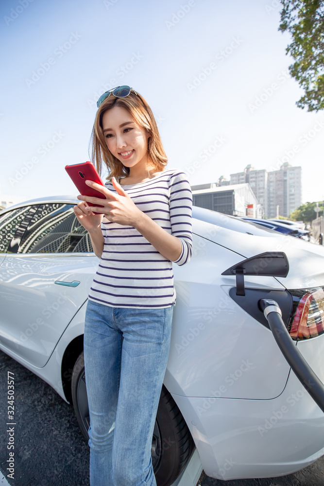 woman Charges electric car