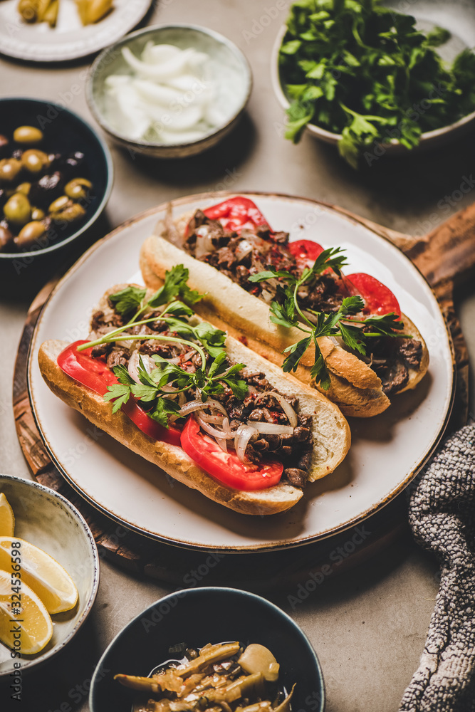 Turkish meat sandwich for lunch. Tantuni sandwich with beef, onion, spices, fresh tomato and parsley