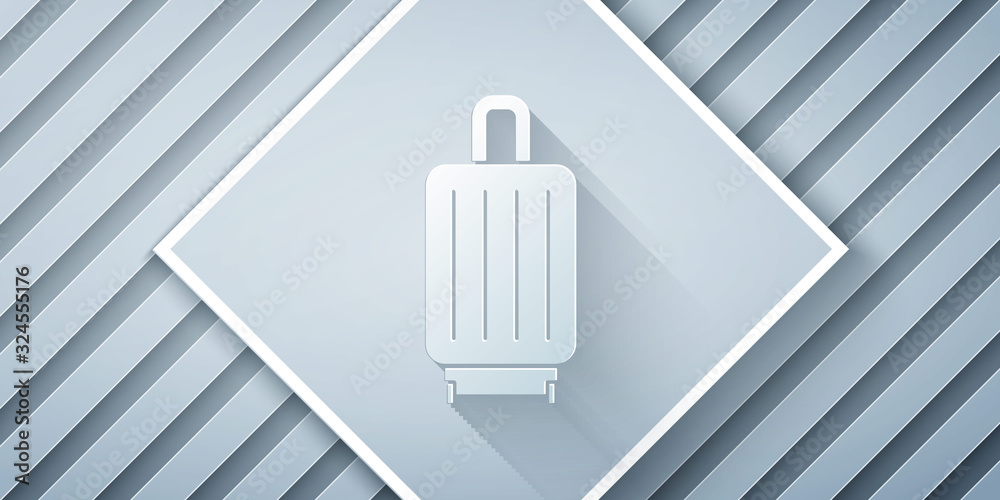 Paper cut Suitcase for travel icon isolated on grey background. Traveling baggage sign. Travel lugga