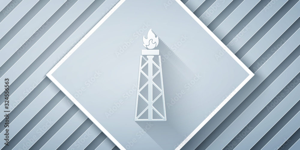 Paper cut Oil rig with fire icon isolated on grey background. Gas tower. Industrial object. Paper ar