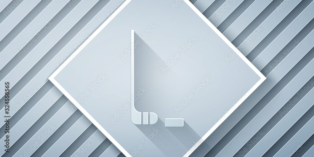 Paper cut Ice hockey stick and puck icon isolated on grey background. Paper art style. Vector Illust