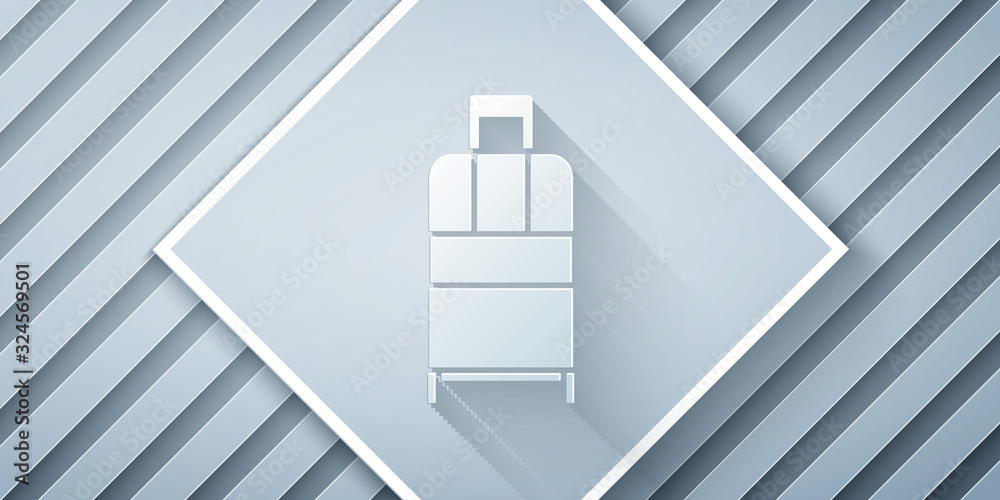 Paper cut Suitcase for travel icon isolated on grey background. Traveling baggage sign. Travel lugga