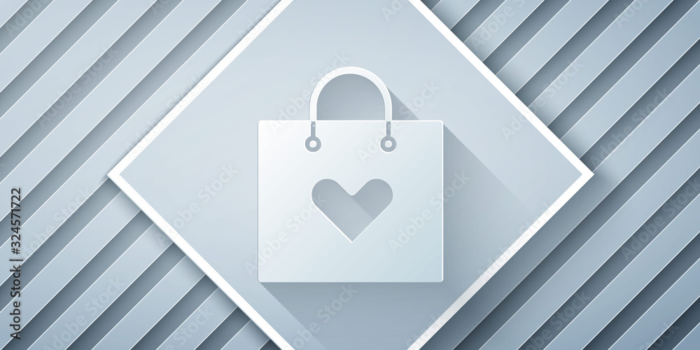 Paper cut Shopping bag with heart icon isolated on grey background. Shopping bag shop love like hear