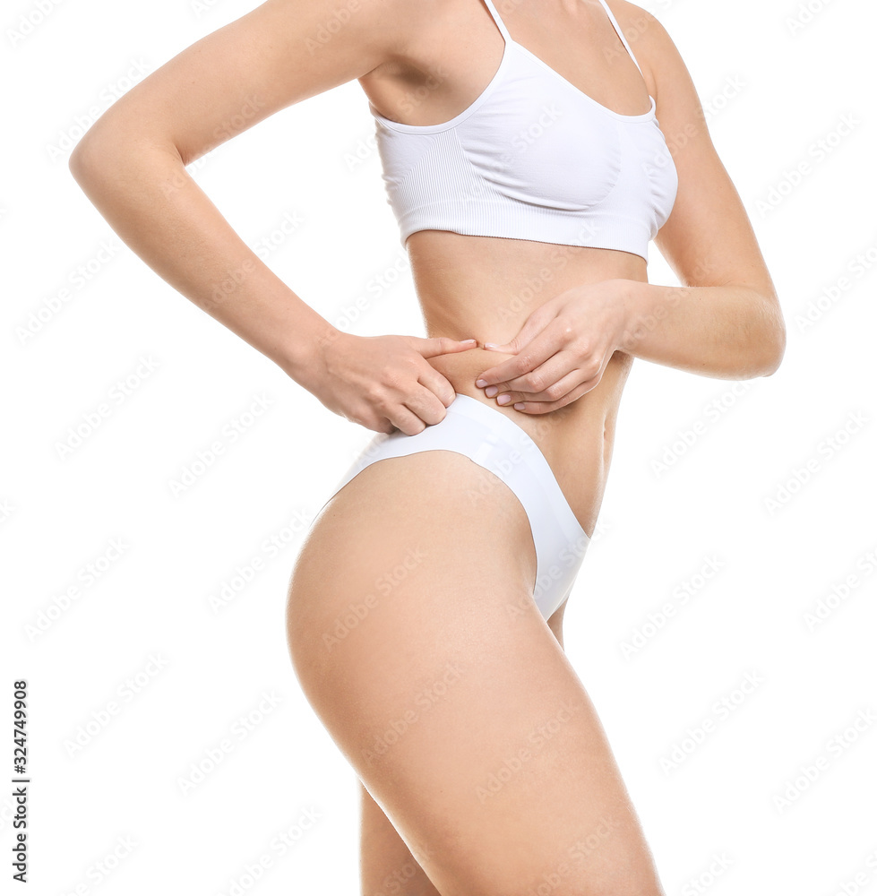 Young woman in underwear on white background. Concept of plastic surgery