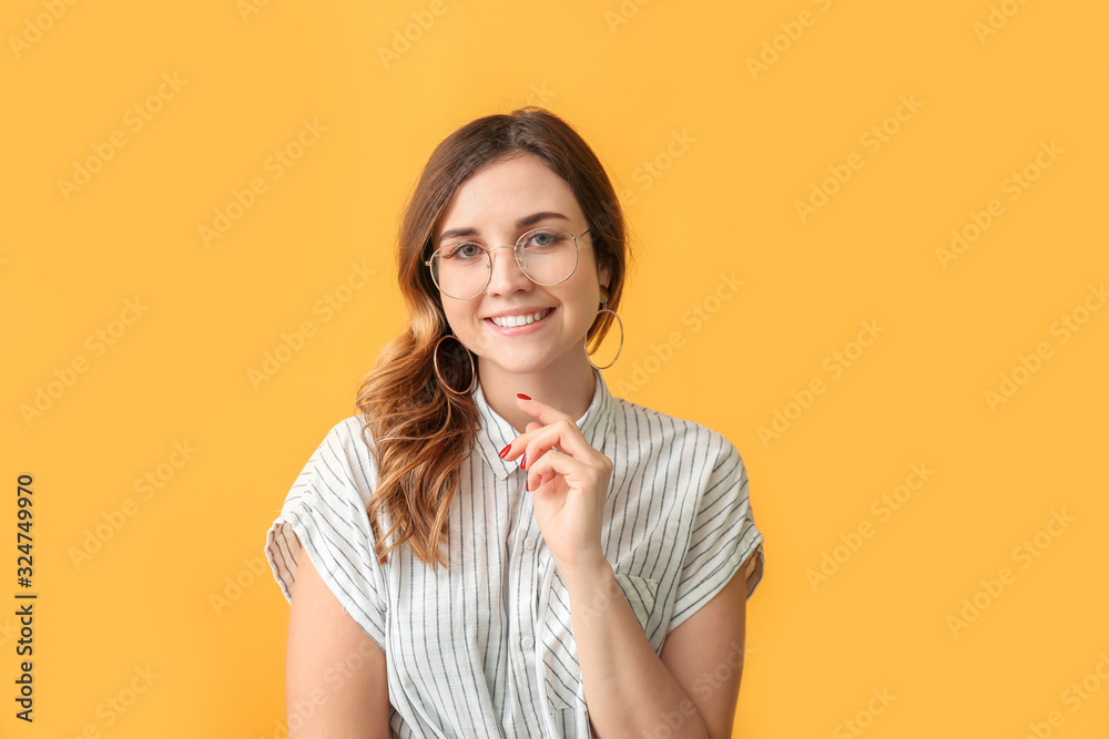 Stylish woman with stylish eyeglasses on color background