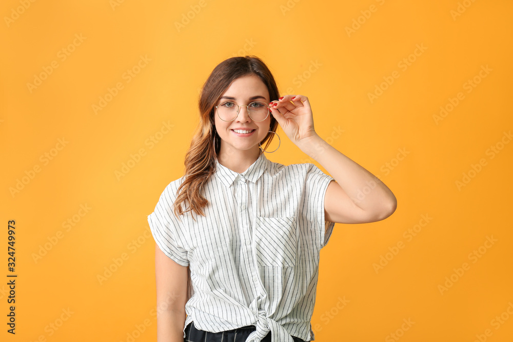 Stylish woman with stylish eyeglasses on color background