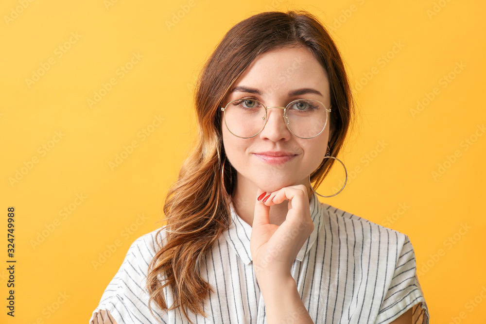 Stylish woman with stylish eyeglasses on color background