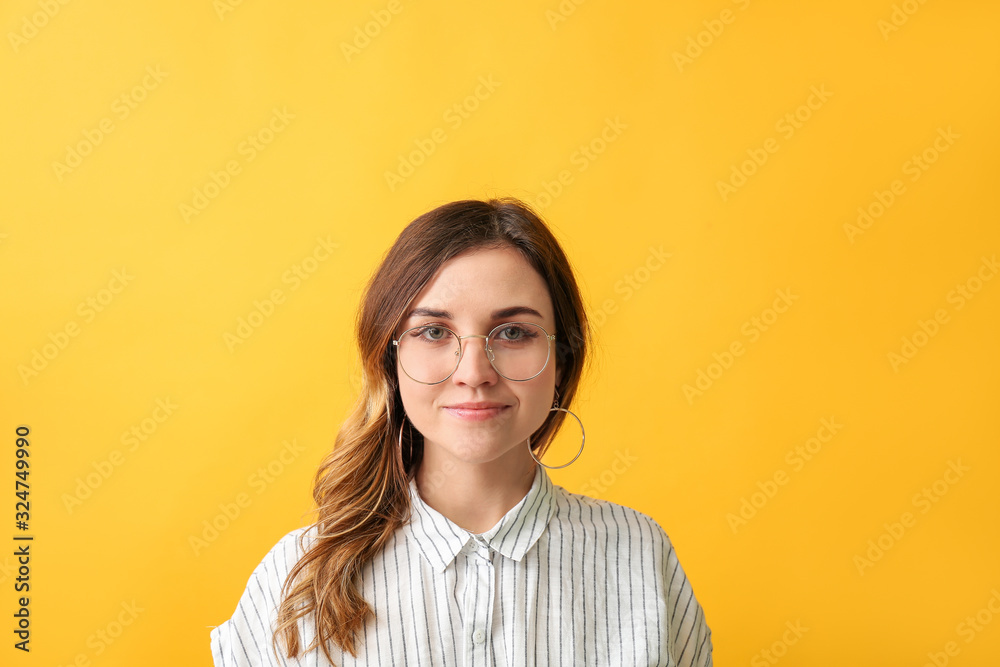 Stylish woman with stylish eyeglasses on color background