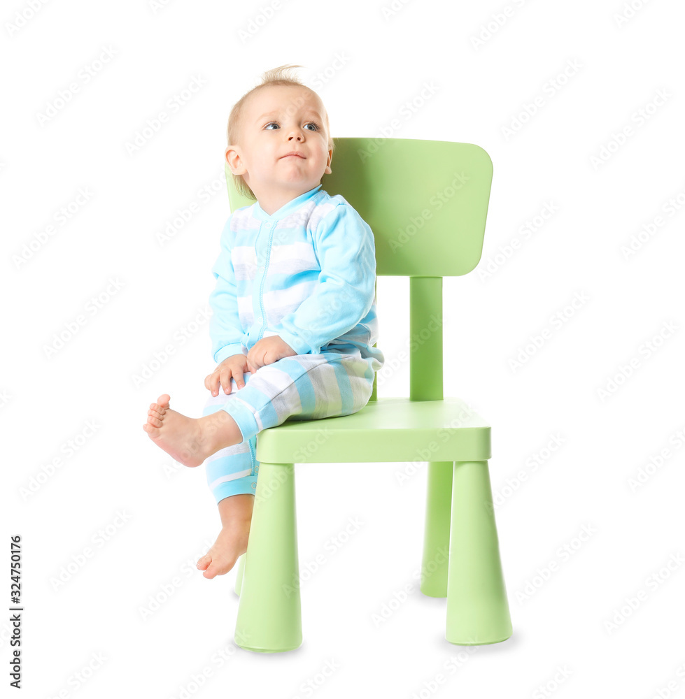 Cute funny baby sitting on chair against white background