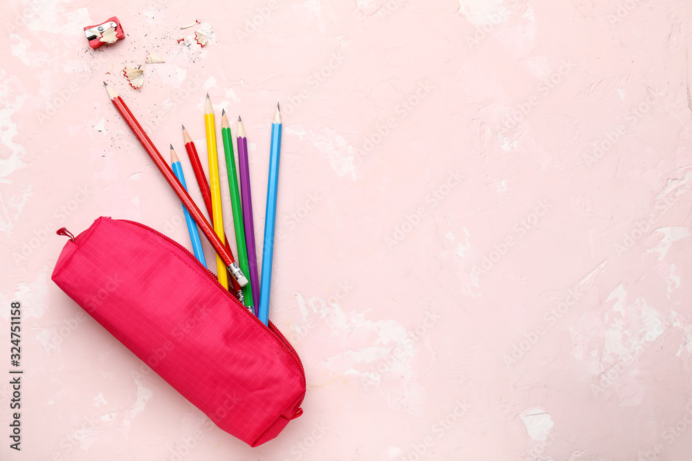 Bag with ordinary pencils on color background