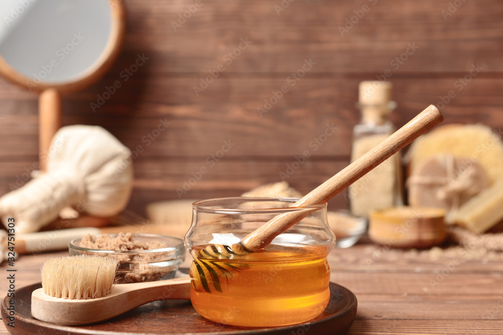 Composition with spa items and honey on table