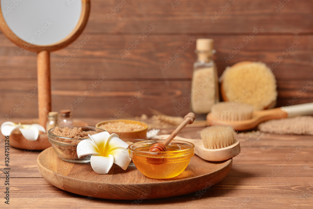 Composition with spa items and honey on table