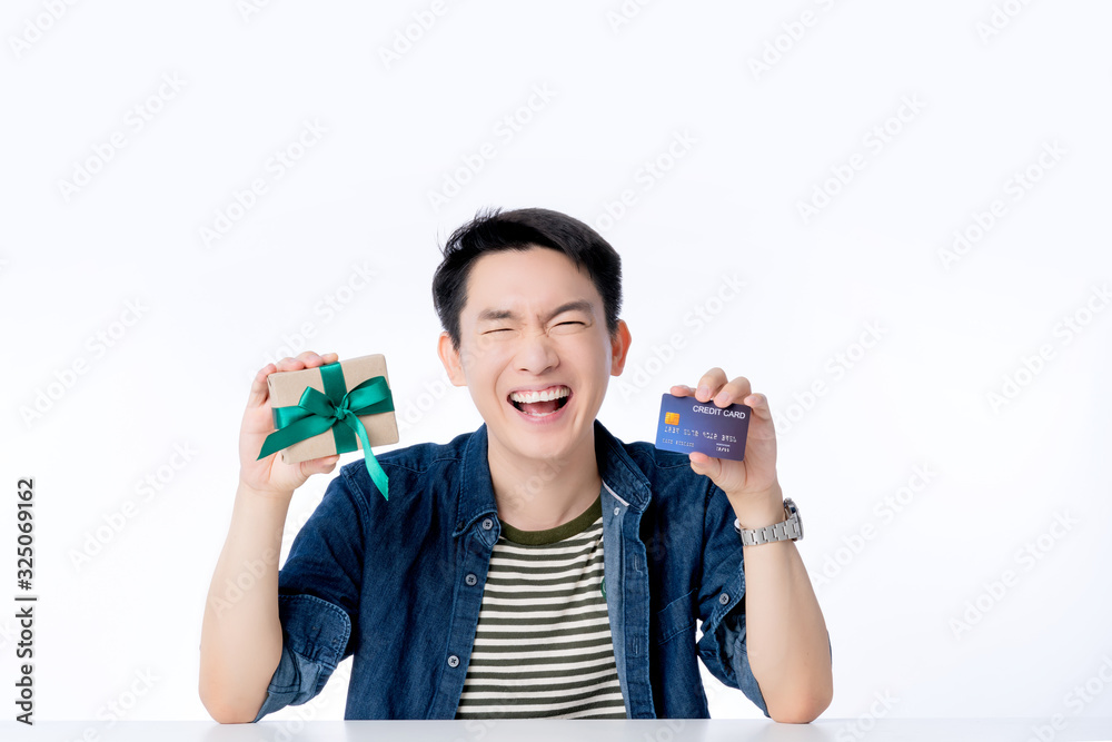 happy asian male casual lifestyle smile laugh hand hold credit card and present box ,exiting asian m