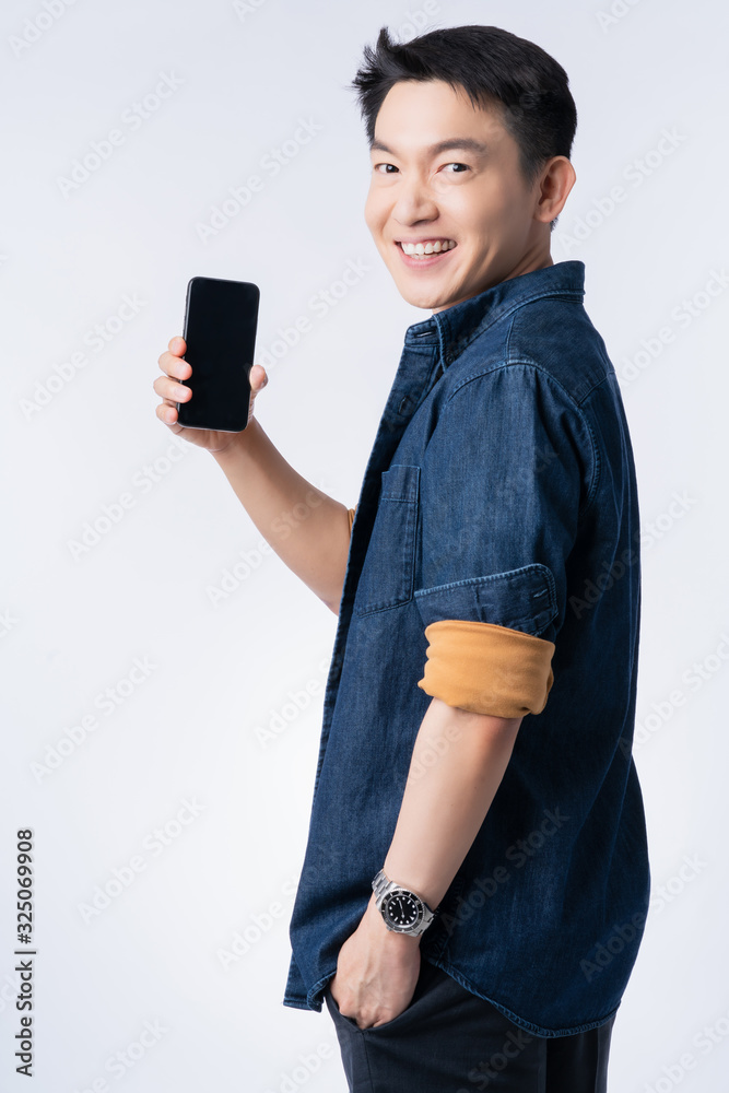 smart casual lifestyle asian male smile with confident hand gesture show black screen smartphone com