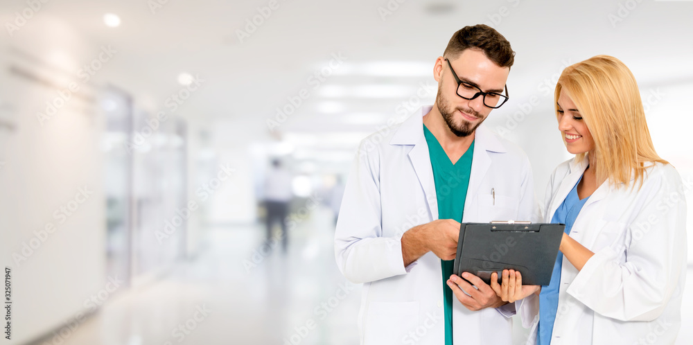 Doctor working with another doctor in the hospital. Healthcare and medical service.