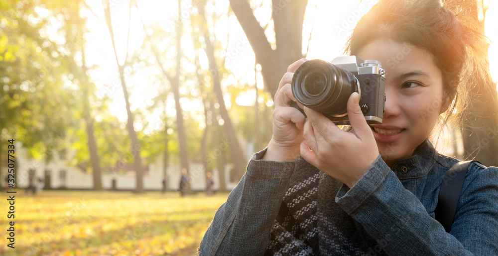 closeup asian woman hand hold retro camera traveller with background of old tradition architecture,a