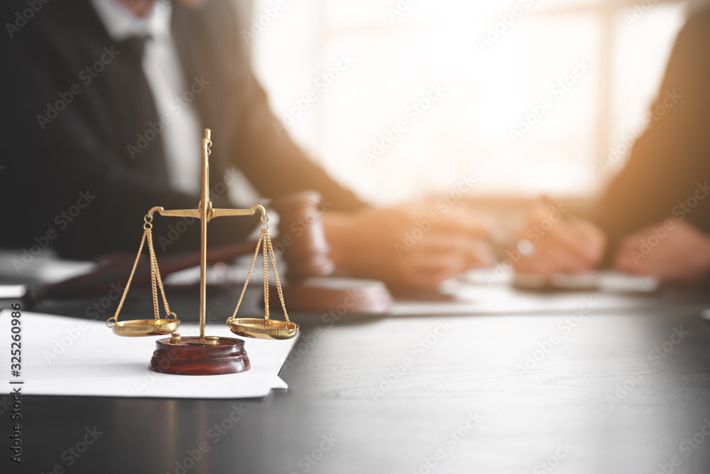 Scales of justice on table of notary public in office