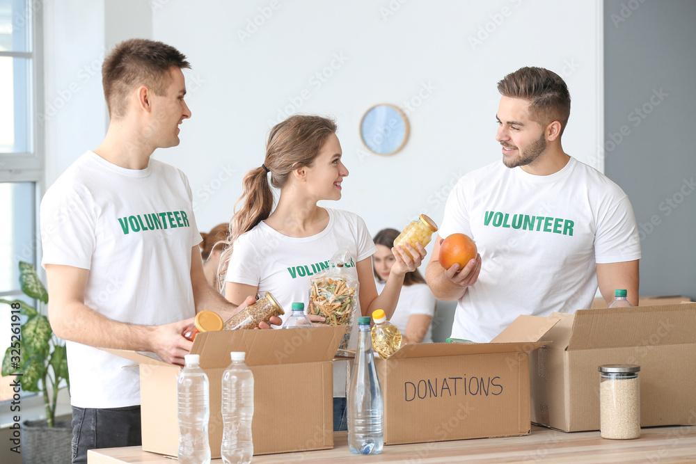 Team of volunteers with products indoors