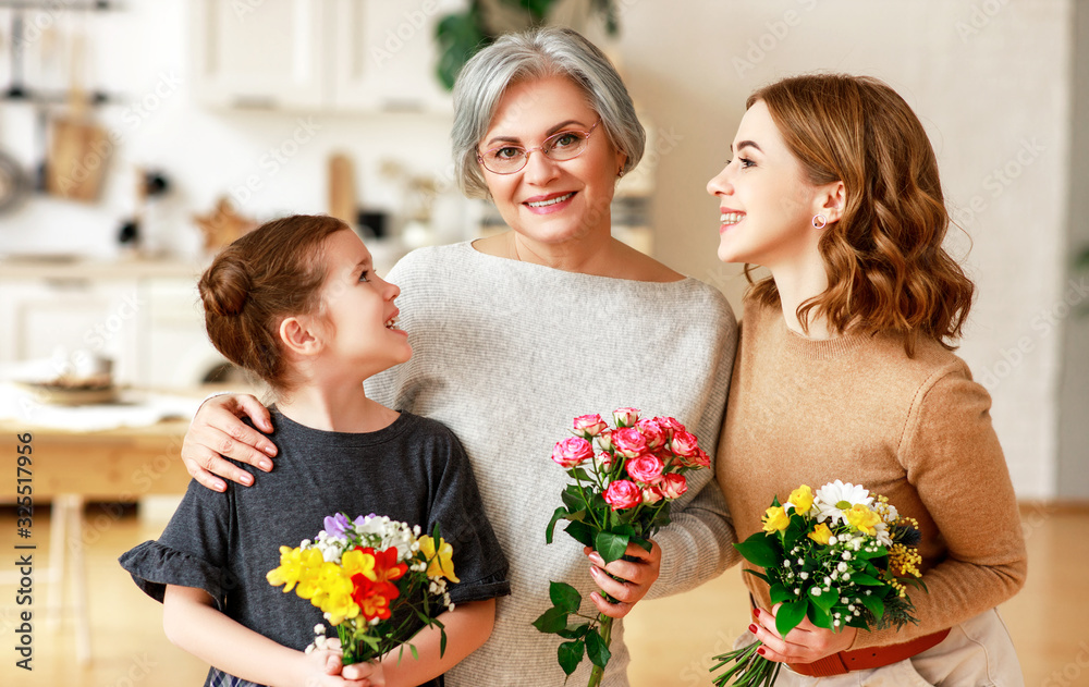 mothers day! three generations of  family mother, grandmother and daughter congratulate on the holi