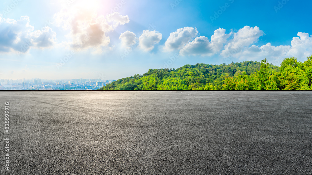 Empty race track and city skyline with green mountain in Hangzhou,China.