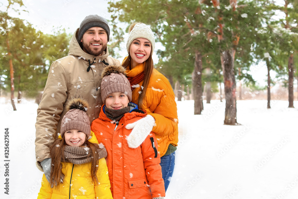 Happy family in park on winter day