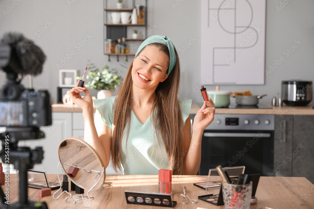 Young beauty blogger recording video at home