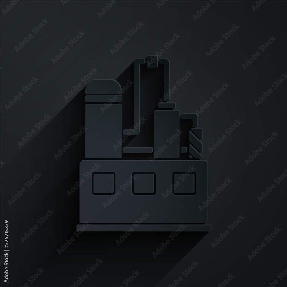 Paper cut Oil and gas industrial factory building icon isolated on black background. Paper art style