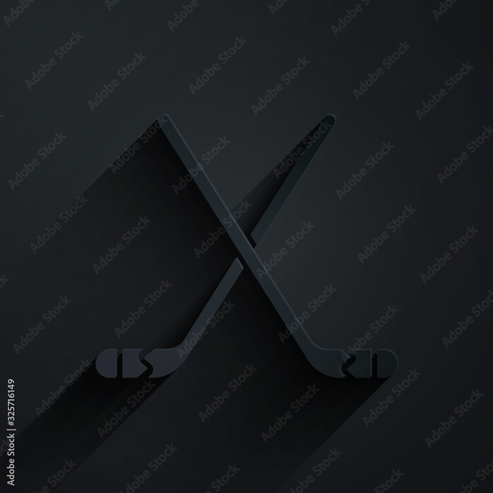 Paper cut Ice hockey sticks icon isolated on black background. Paper art style. Vector Illustration