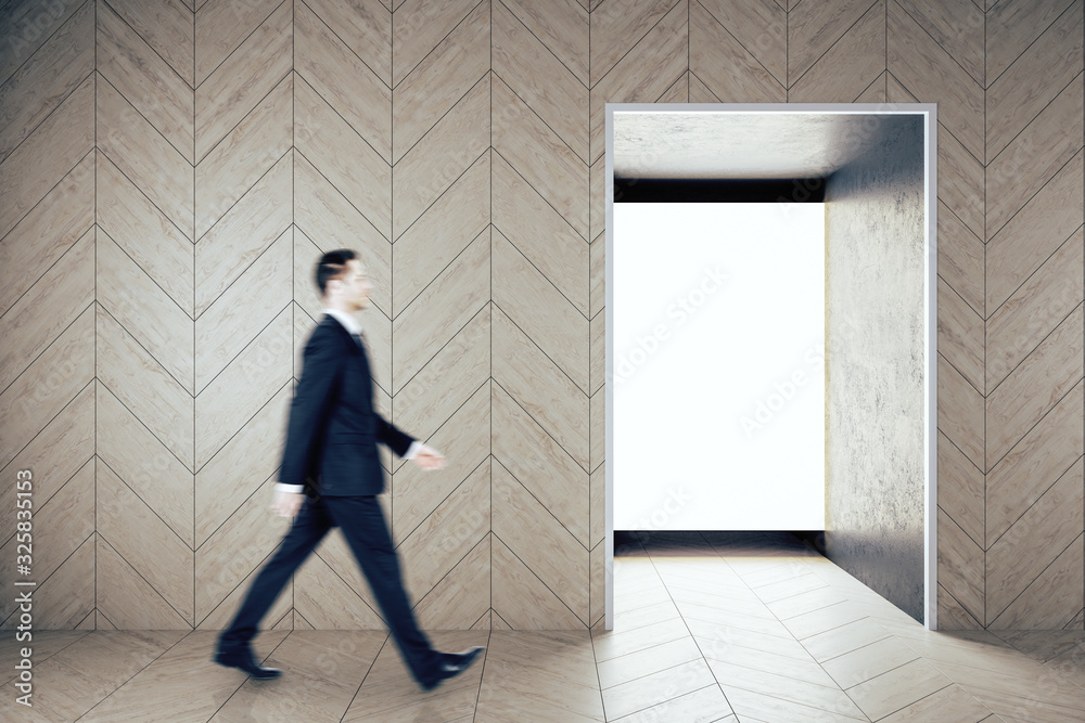 Businessman walking in contemporary gallery interior