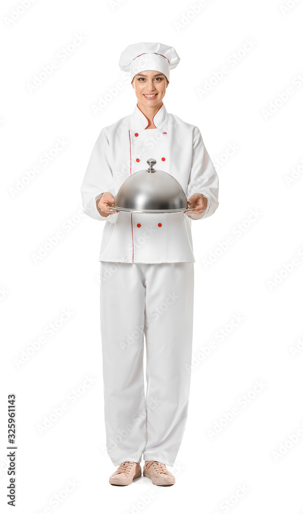 Beautiful female chef with tray and cloche on white background