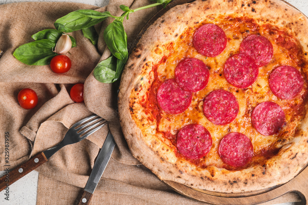 Board with tasty pizza on table