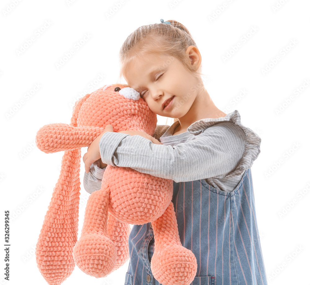 Cute little girl with toy on white background