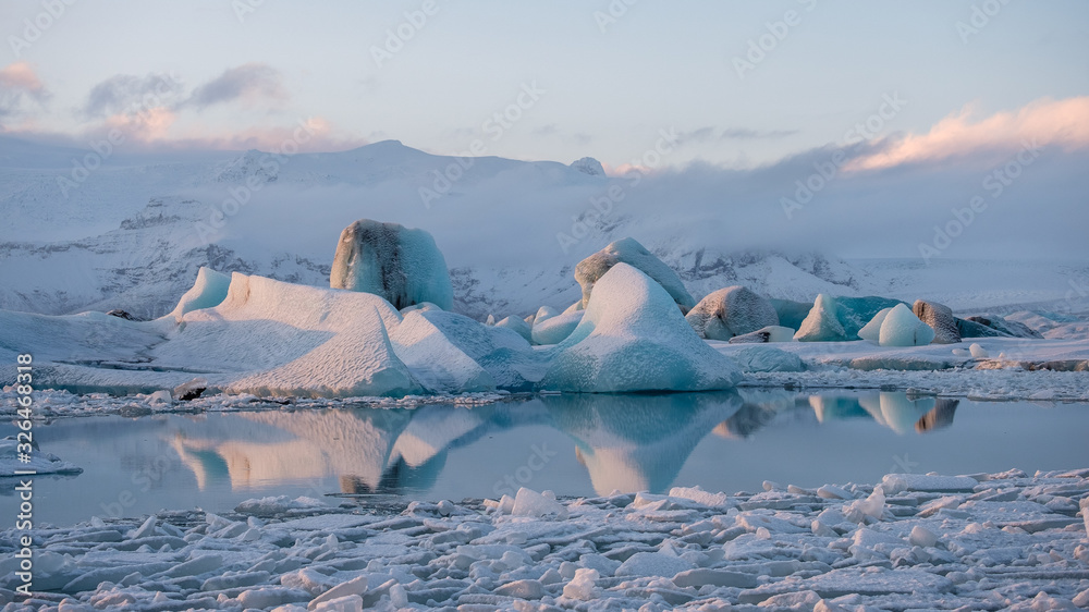 Iceland: Icebergs reflected in the Jökulsárlón Glacier Lagoon