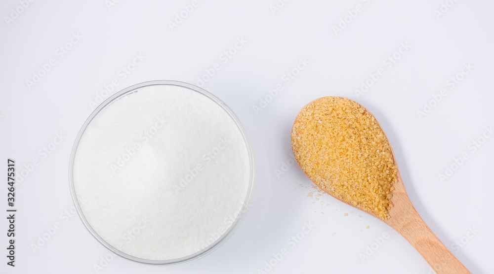 Brown sugar in a round glass cup on a white background, healthy sugar. Used for cooking or desserts.