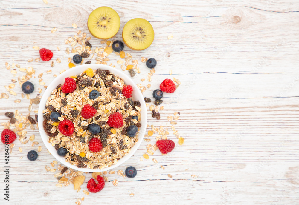 Breakfast Served in the morning with corn flakes Whole grains and raisins with milk in cups and Stra