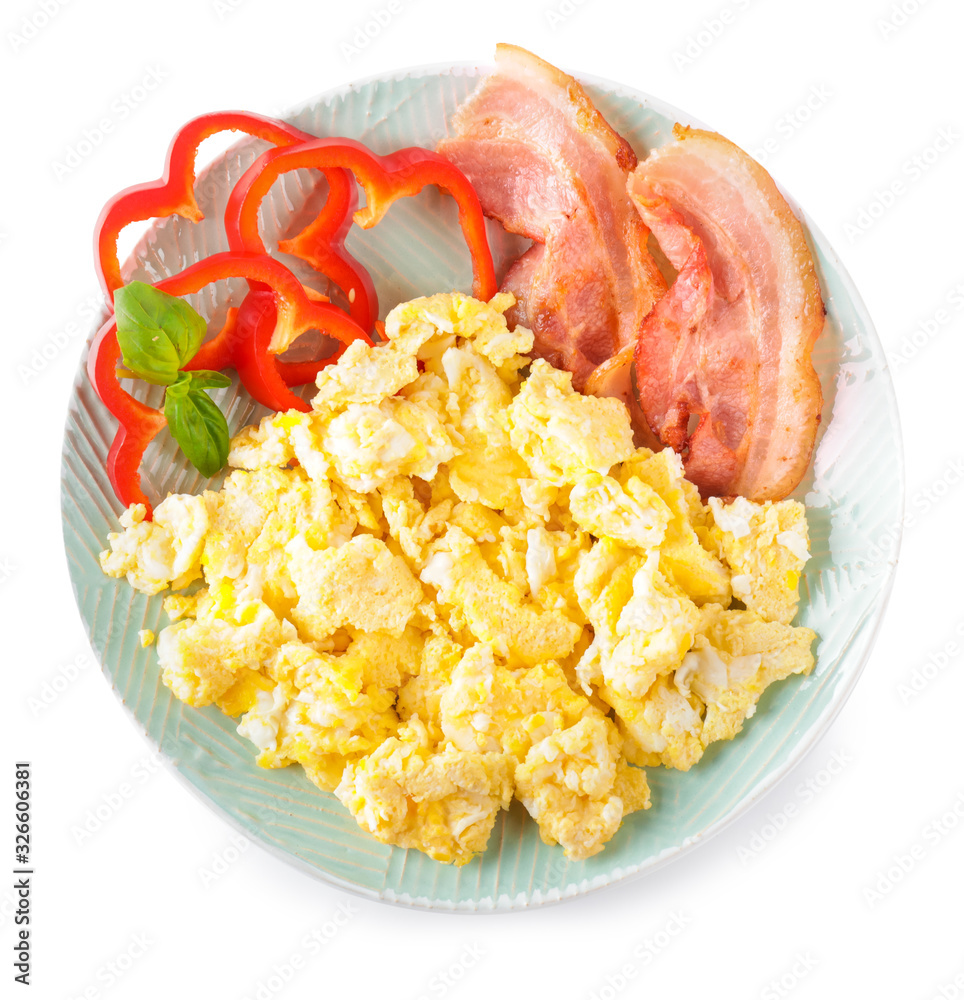 Plate with tasty scrambled eggs and bacon on white background