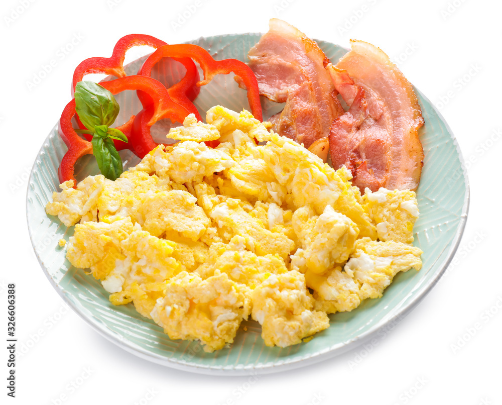 Plate with tasty scrambled eggs and bacon on white background