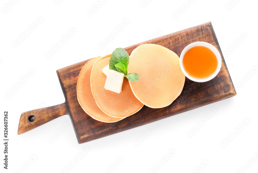 Tasty pancakes with honey and butter on white background