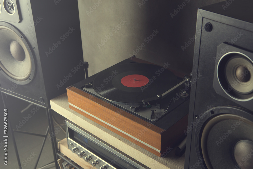 HiFi system with turntable, amplifier and speakers in a studio