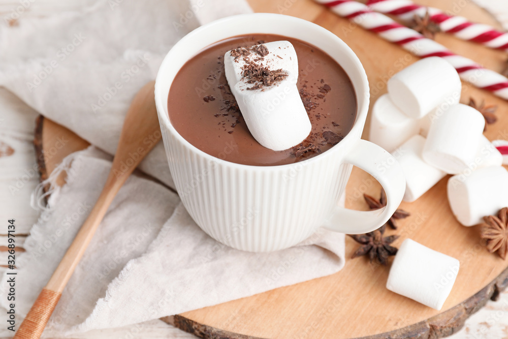 Cup of hot chocolate on white wooden table