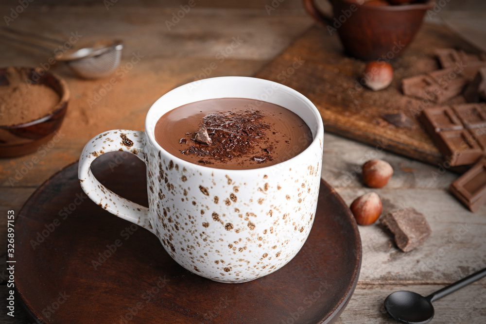 Cup of hot chocolate on wooden table